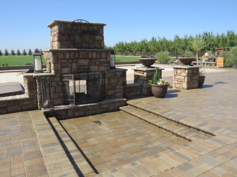 This is a picture of fireplace masonry work and a stamped concrete patio in Granite Bay, California