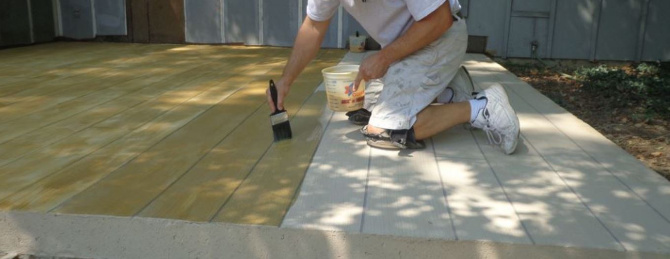 an image of a concrete contractor resurfacing a patio in elk grove, ca